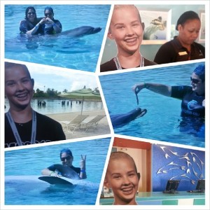 Nancy Beth and #FlatLola swimming with the dolphins at Atlantis